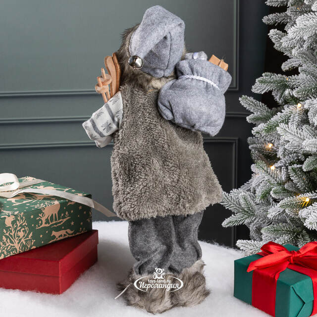 Санта - Северный волшебник с подарками и лыжами 45 см Peha