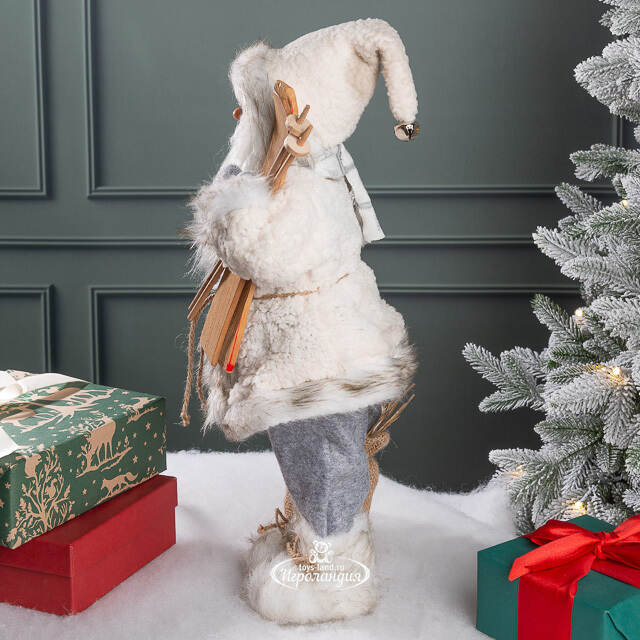 Санта в овечьей шубе с подарками и лыжами 46 см Peha