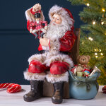 Фигурка Санта Клаус со щелкунчиком в красном кафтане - Merry Christmas 19 см